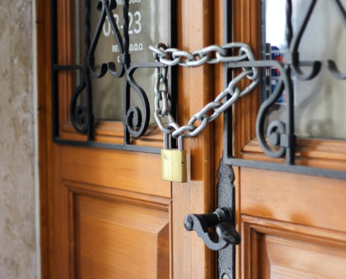 Wooden doors padlocked shut