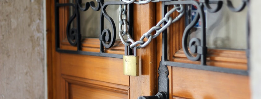 Wooden doors padlocked shut
