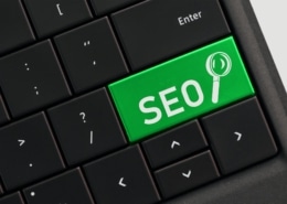 Search engine optimization concept - SEO with magnifying glass on computer key keyboard